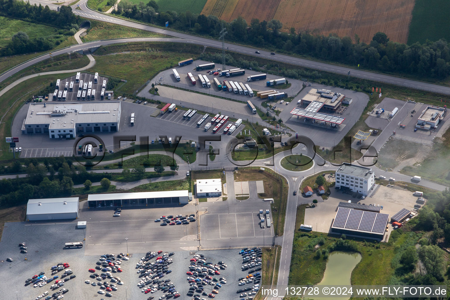 Aerial view of Esso Autohof Pilsting and car auction house Copart Deutschland GmbH - Munich location in Pilsting in the state Bavaria, Germany