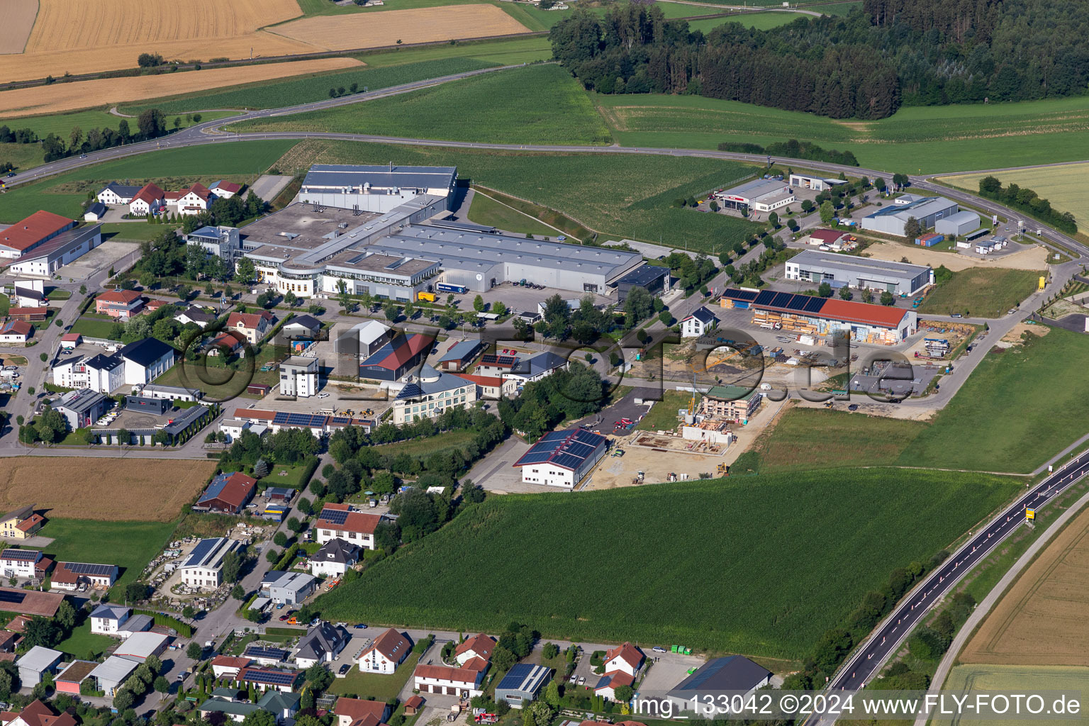 Industrial area Diesel-/Benzstraße with Pöschl Tabak GmbH & Co. KG in Geisenhausen in the state Bavaria, Germany