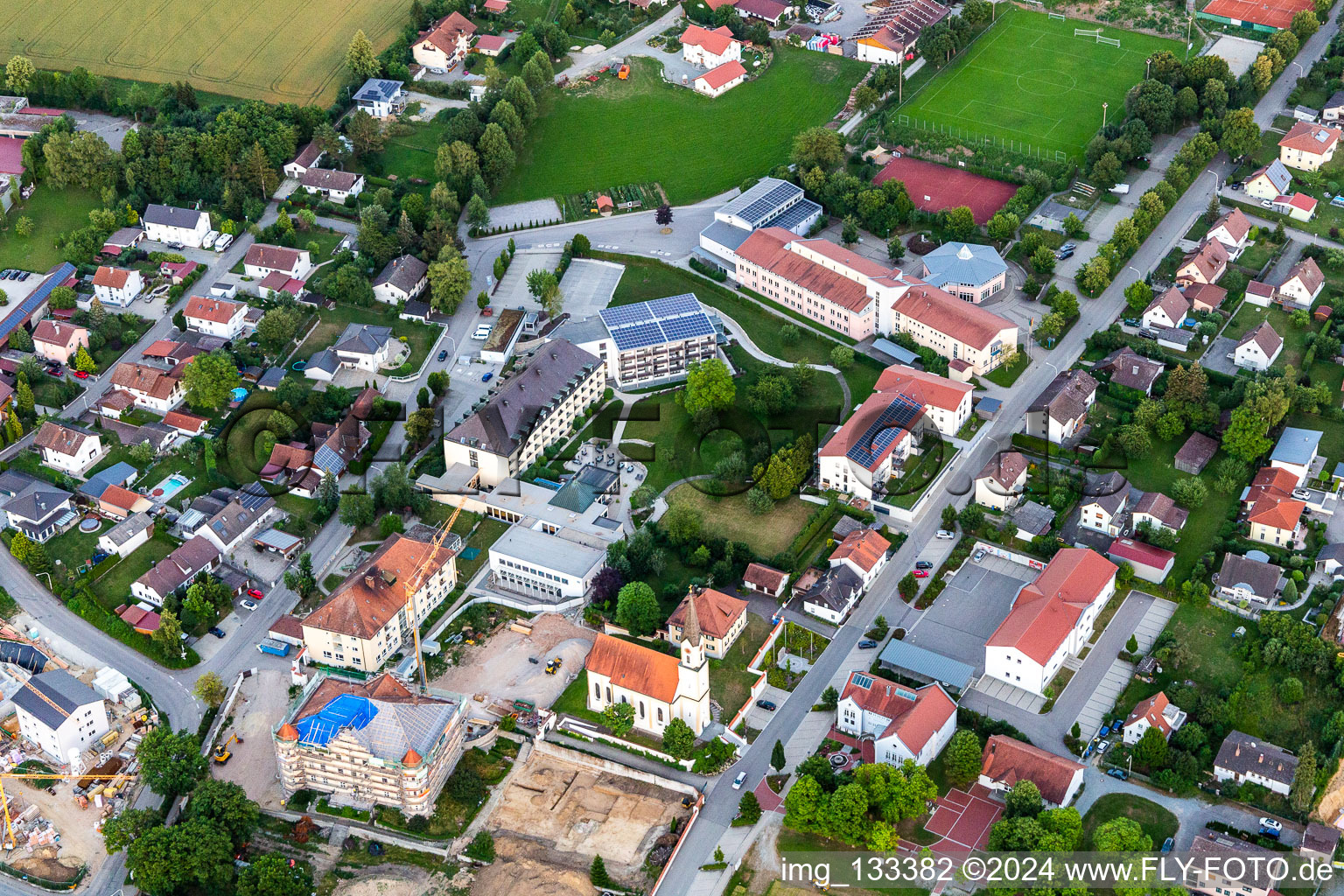 Aerial photograpy of Church of the Annunciation and PhysioKlinik im Aitrachtal GmbH in the district Weichshofen in Mengkofen in the state Bavaria, Germany