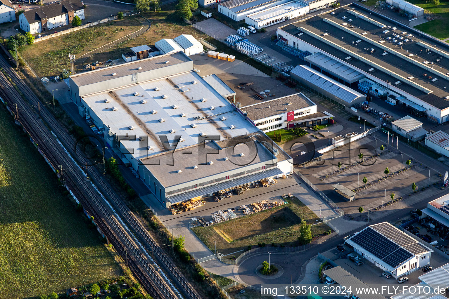 Aerial view of Siemensstrasse industrial area with Hartmann & König Stromzuführungs AG and Tombor GmbH in the district Neudorf in Graben-Neudorf in the state Baden-Wuerttemberg, Germany