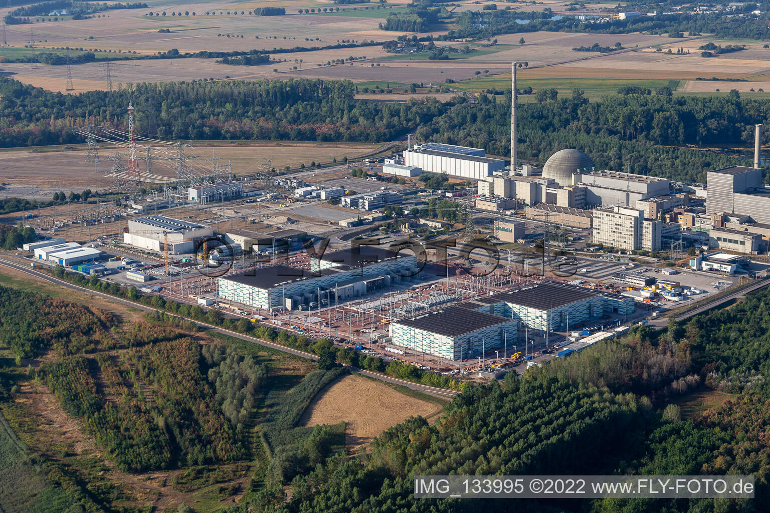 Oblique view of TransnetBW GmbH, direct current substation on the site of the decommissioned nuclear power plant Philippsburg in Philippsburg in the state Baden-Wuerttemberg, Germany