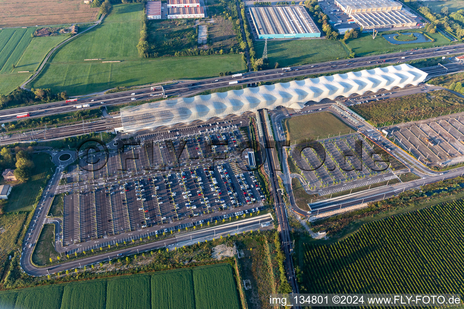 Parking next to the Autostrade del Sole at Reggio Emilia AV Mediopadana train station in Reggio nell’Emilia in the state Reggio Emilia, Italy