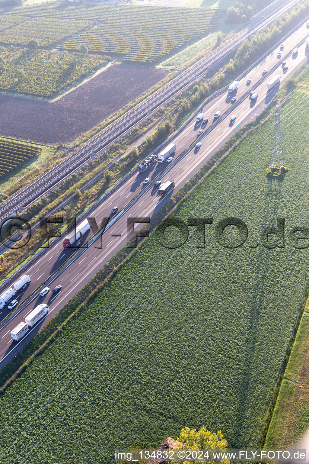 Aerial view of Autostrada del Sole next to the high-speed rail line in San Martino in Rio in the state Reggio Emilia, Italy