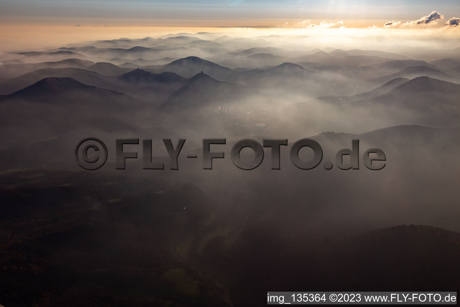 The 3 castles: Münz, Anebos and Trifels in the haze from the north in the district Queichhambach in Annweiler am Trifels in the state Rhineland-Palatinate, Germany