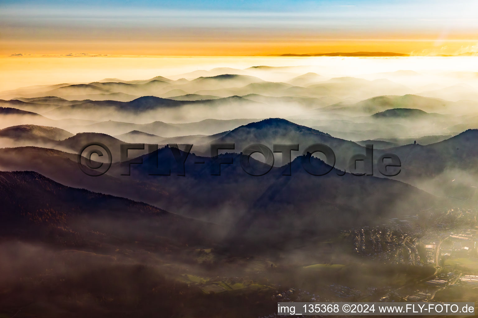 The 3 castles: Münz, Anebos and Trifels in the haze from the north in Annweiler am Trifels in the state Rhineland-Palatinate, Germany