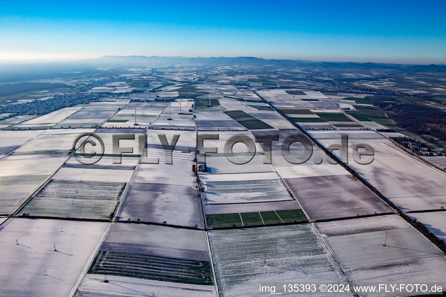 Wind turbines in winter with snow in Minfeld in the state Rhineland-Palatinate, Germany