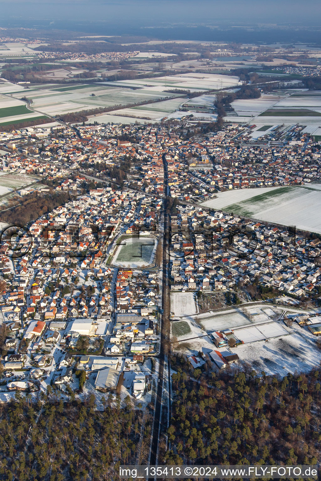 Aerial view of Kandelerstraße in winter with snow in Rheinzabern in the state Rhineland-Palatinate, Germany