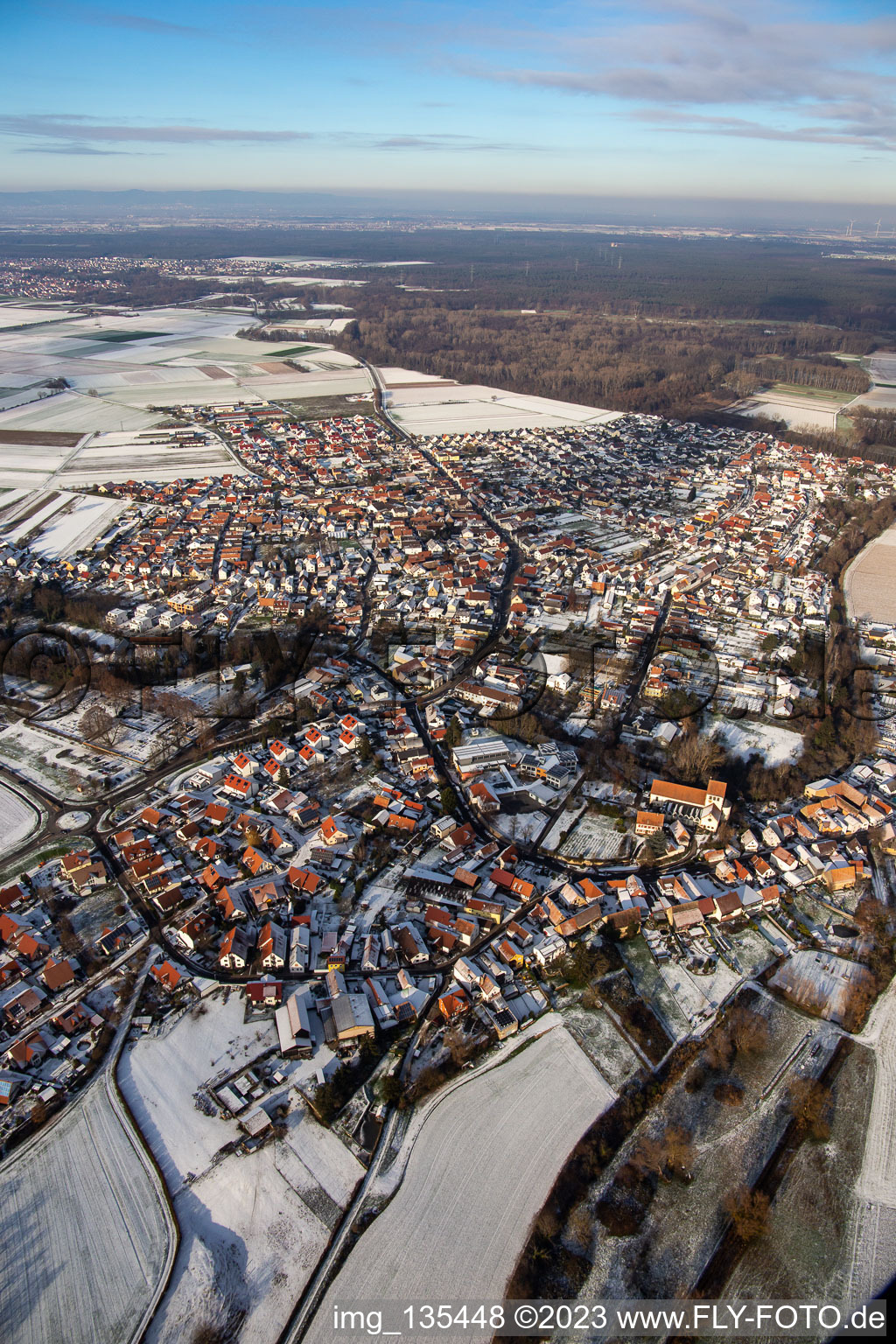 Aerial view of Bellheimer Straße in winter with snow in Hördt in the state Rhineland-Palatinate, Germany