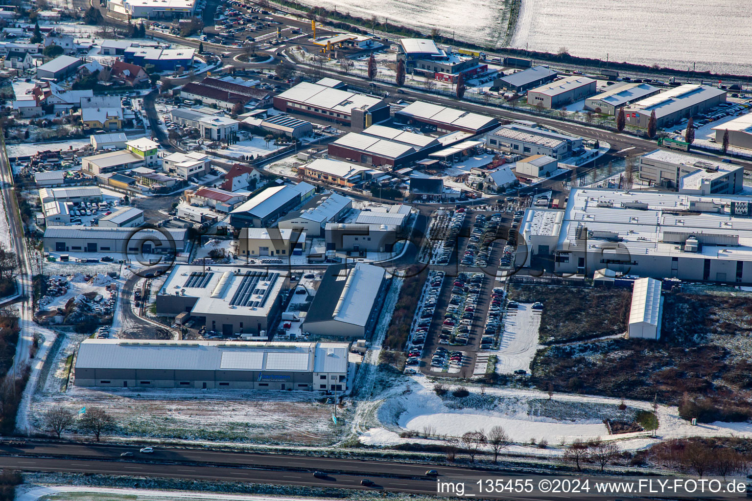 Industrial area on the level in winter with snow in Rülzheim in the state Rhineland-Palatinate, Germany