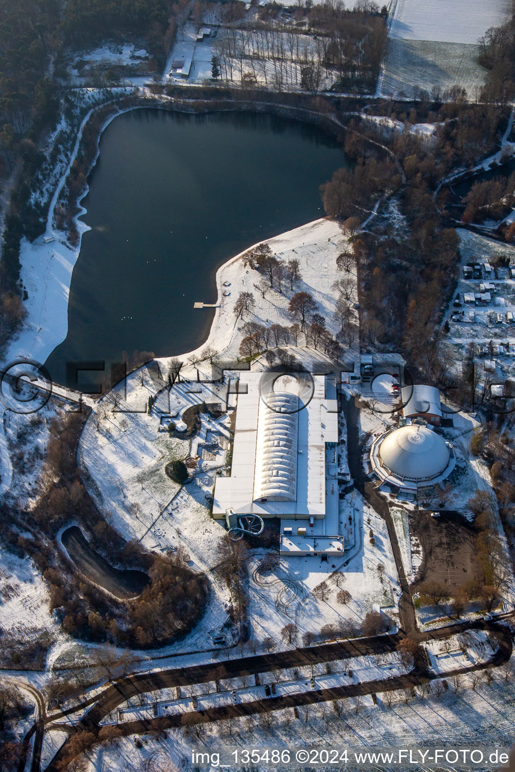 Oblique view of Lido, steam dumpling hall in winter when there is snow in Rülzheim in the state Rhineland-Palatinate, Germany