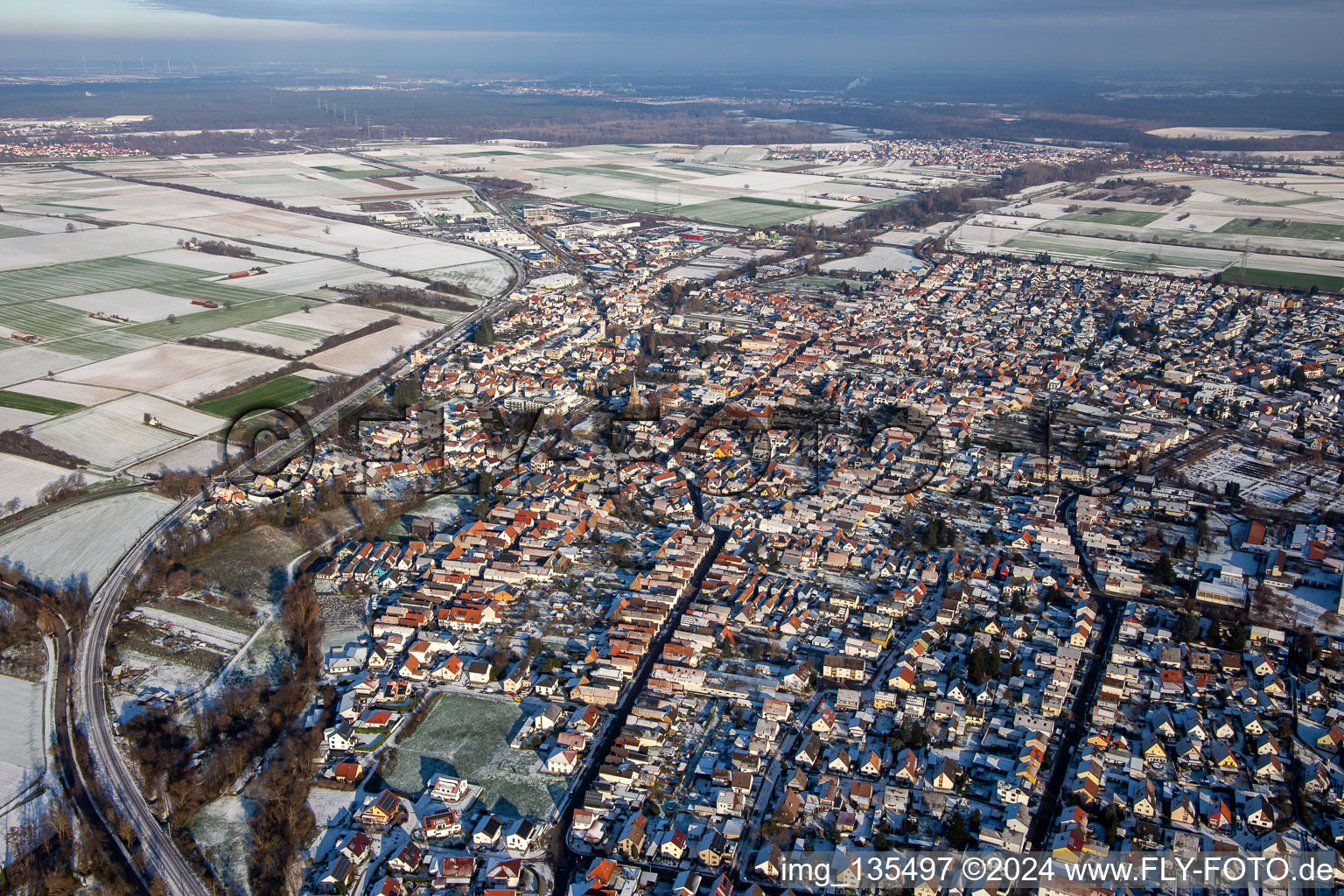 From the west in winter when there is snow in Rülzheim in the state Rhineland-Palatinate, Germany from above