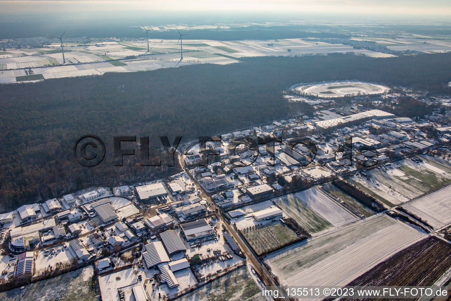 Aerial view of Am Gäxwald commercial area in winter with snow in the district Herxheim in Herxheim bei Landau in the state Rhineland-Palatinate, Germany