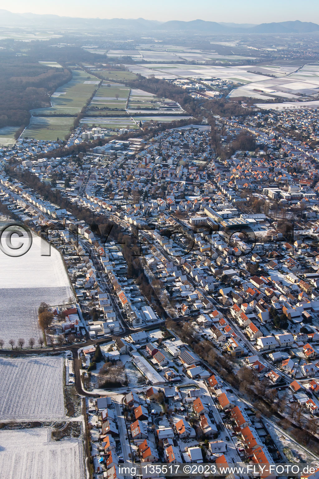 Ketteler Straße in winter with snow in the district Herxheim in Herxheim bei Landau in the state Rhineland-Palatinate, Germany