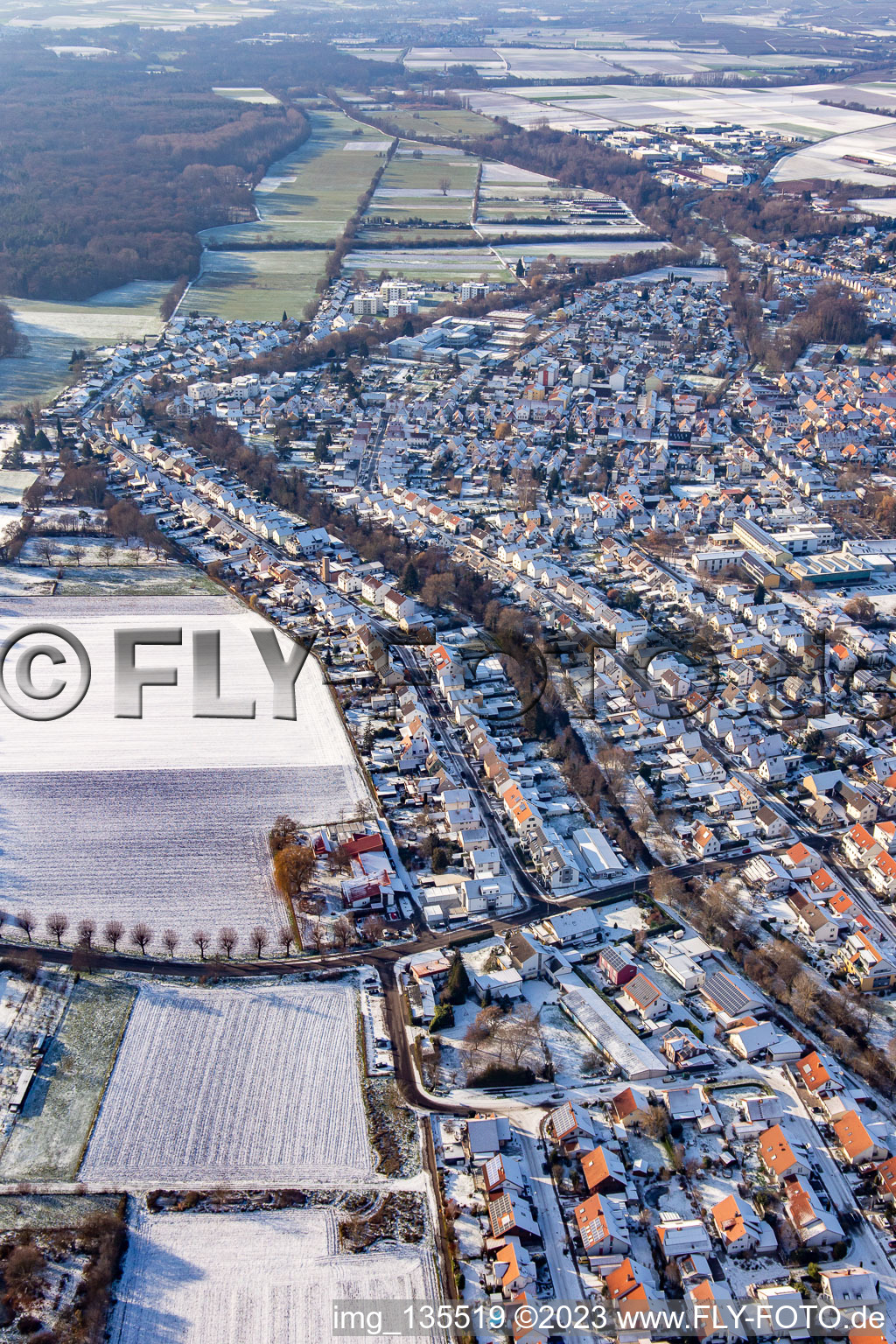 Litzelhorststraße in winter with snow in the district Herxheim in Herxheim bei Landau in the state Rhineland-Palatinate, Germany