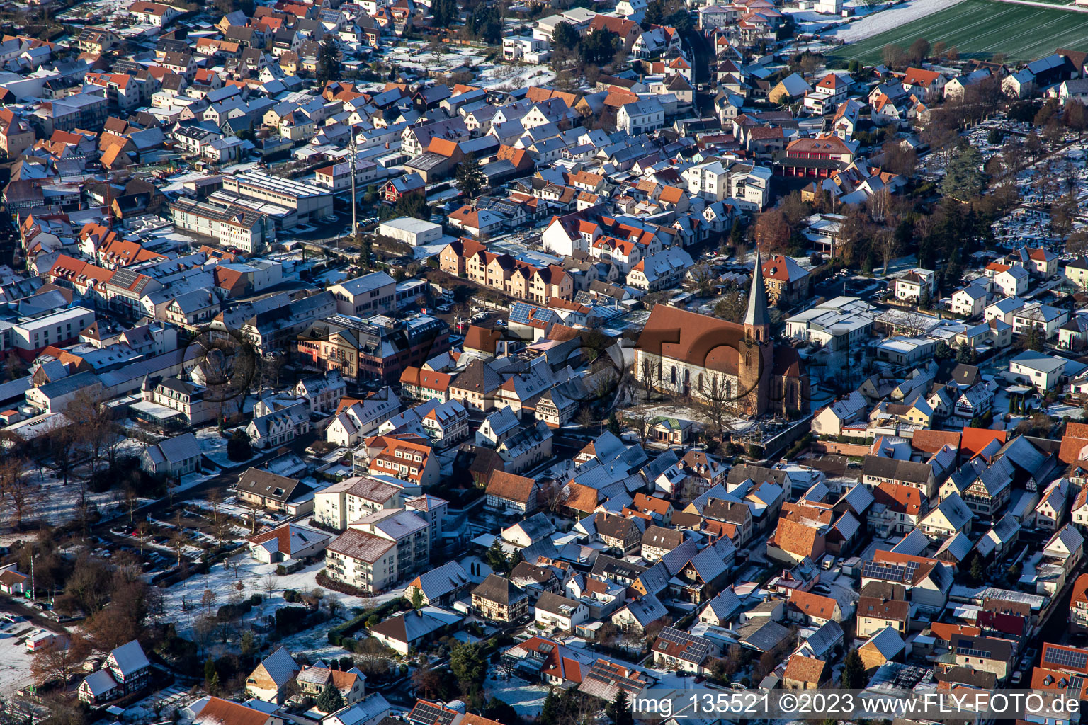 Church of St. Mary's Assumption in winter with snow in the district Herxheim in Herxheim bei Landau in the state Rhineland-Palatinate, Germany