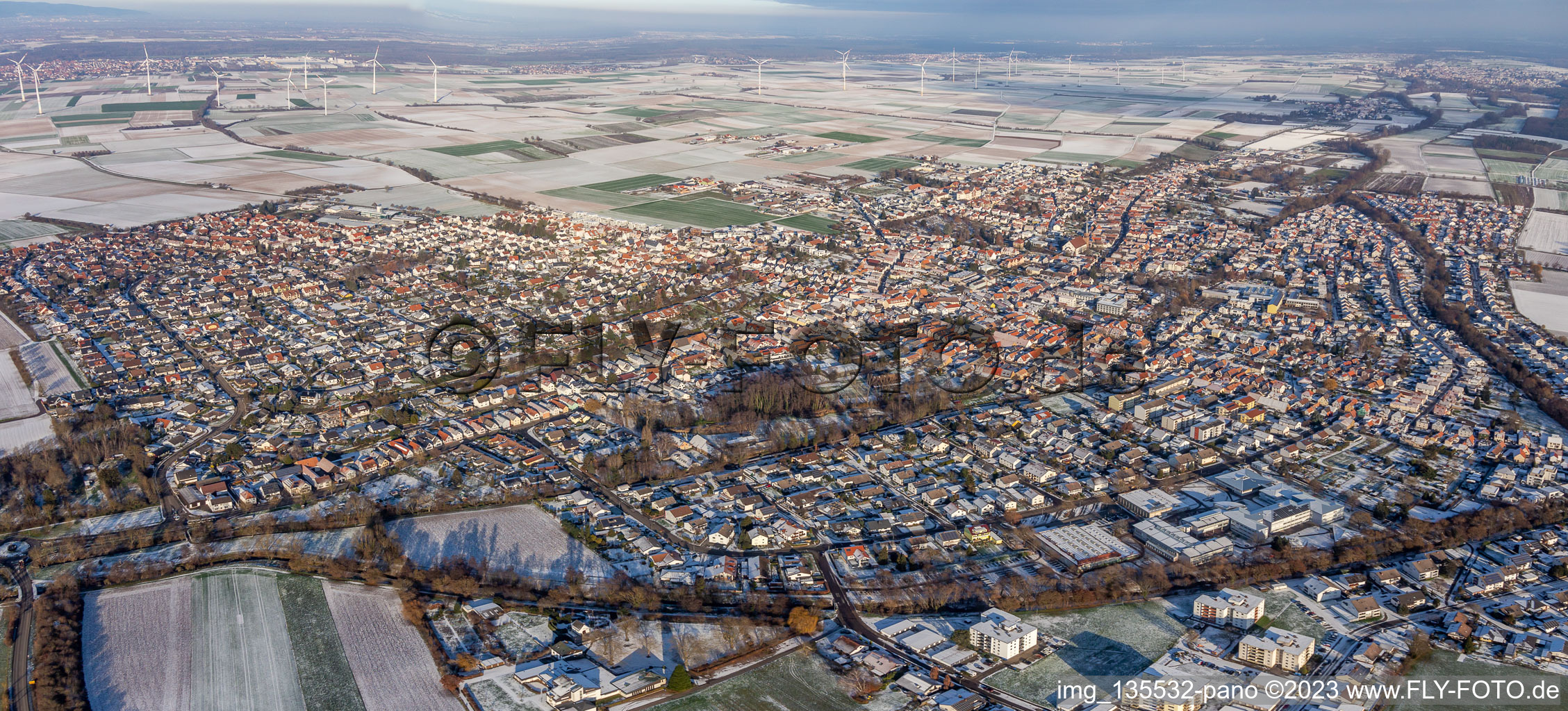 City panorama in winter with snow in the district Herxheim in Herxheim bei Landau in the state Rhineland-Palatinate, Germany