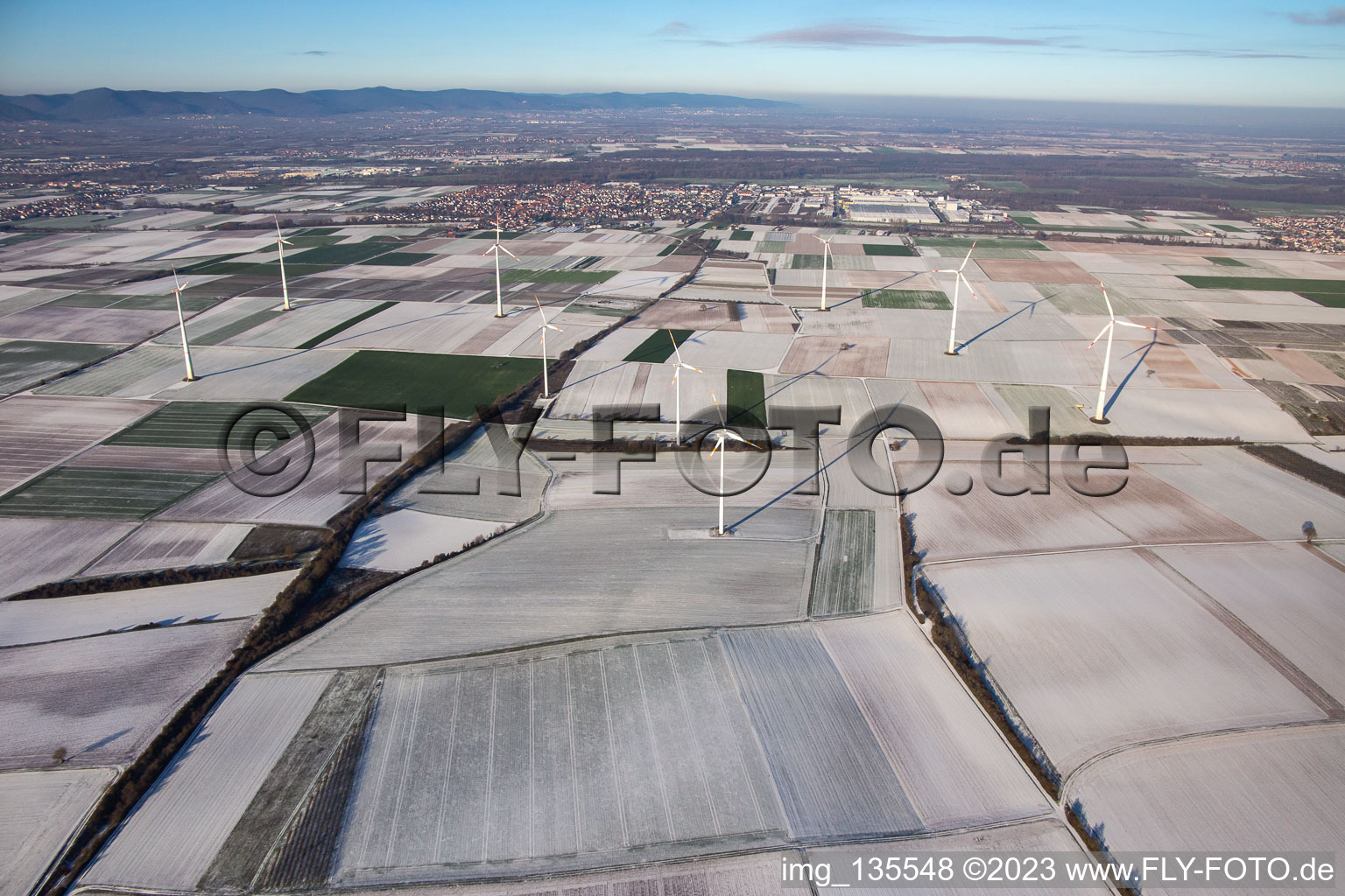 Wind farm in winter with snow in Offenbach an der Queich in the state Rhineland-Palatinate, Germany