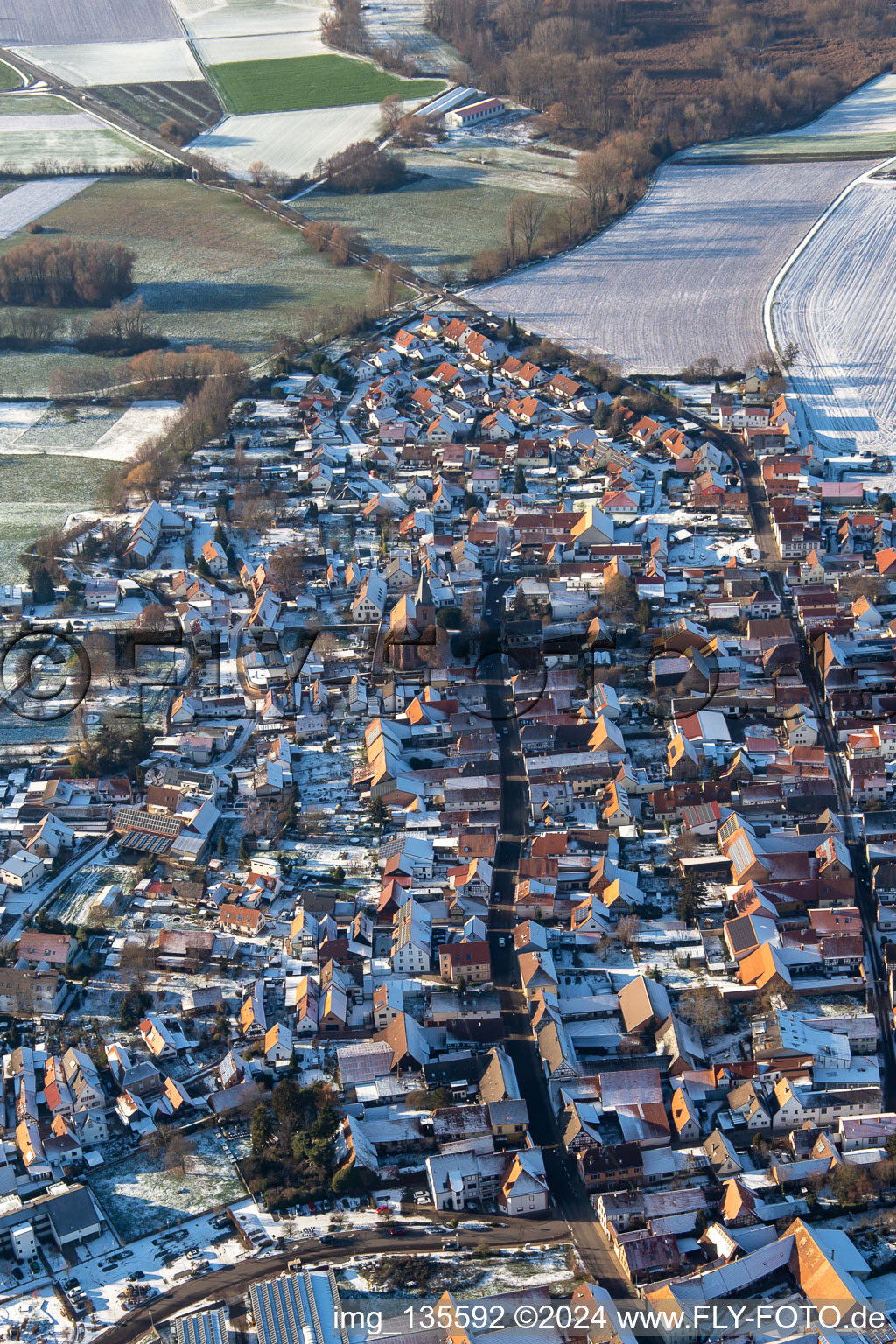 Aerial view of Back alley and main street in winter with snow in Rohrbach in the state Rhineland-Palatinate, Germany