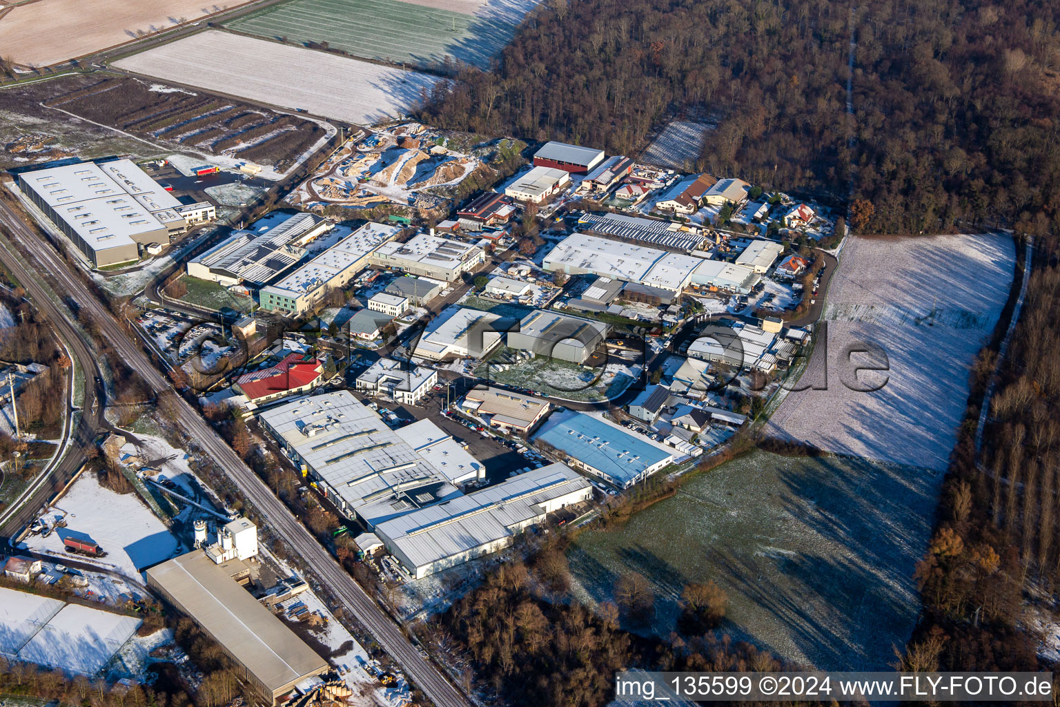 Aerial view of Große Ahlmühle industrial estate in winter with snow in Rohrbach in the state Rhineland-Palatinate, Germany