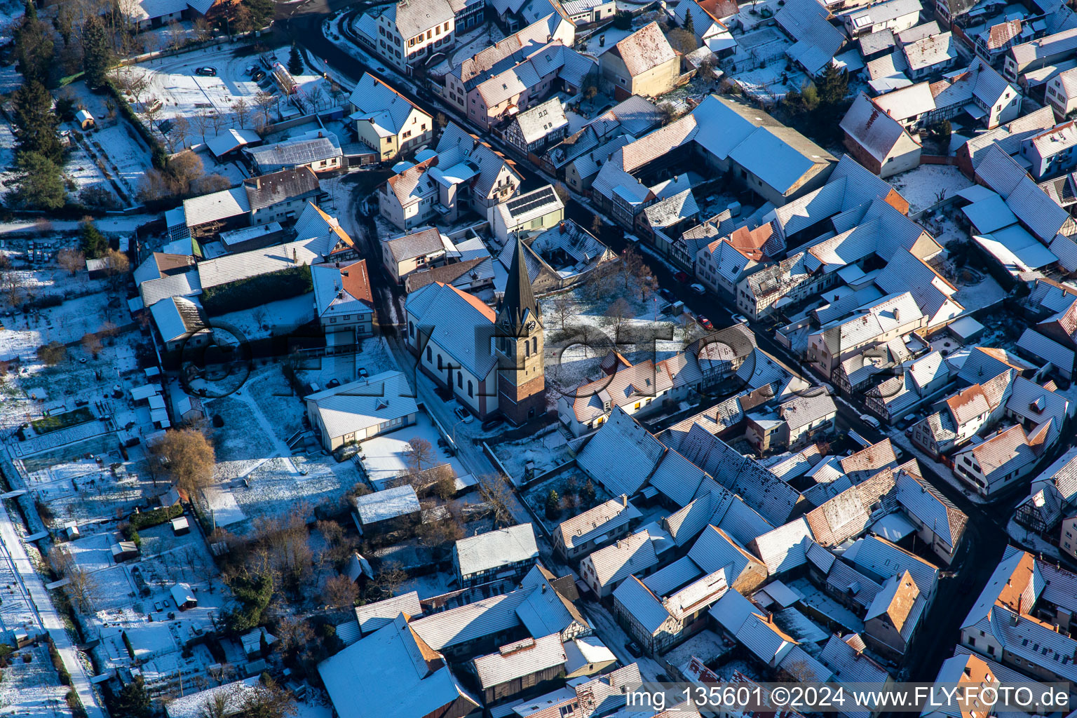 Church of St. Martin in winter with snow in Steinweiler in the state Rhineland-Palatinate, Germany