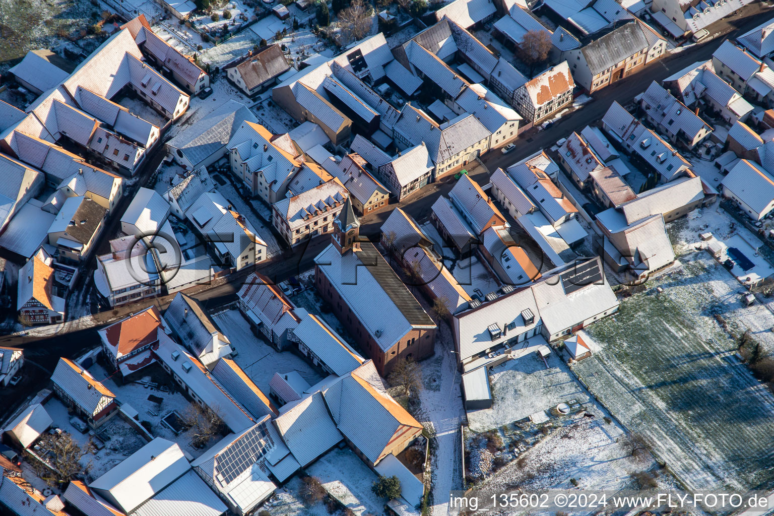 Protestant church in winter with snow in Steinweiler in the state Rhineland-Palatinate, Germany