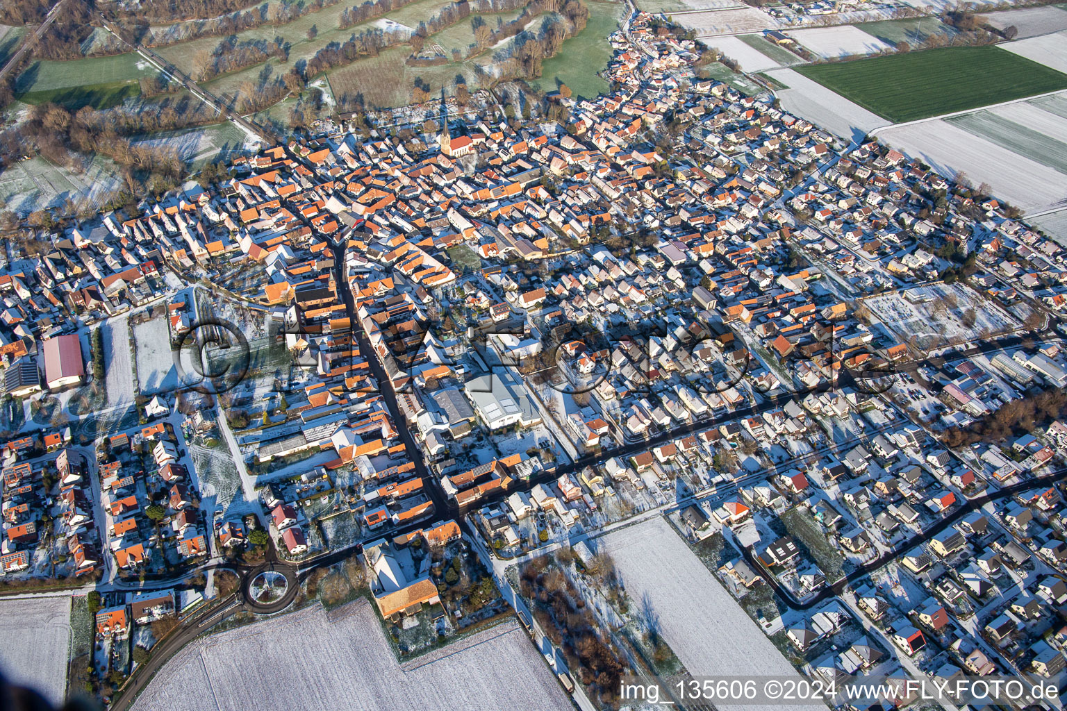 Aerial view of Main street in winter with snow in Steinweiler in the state Rhineland-Palatinate, Germany