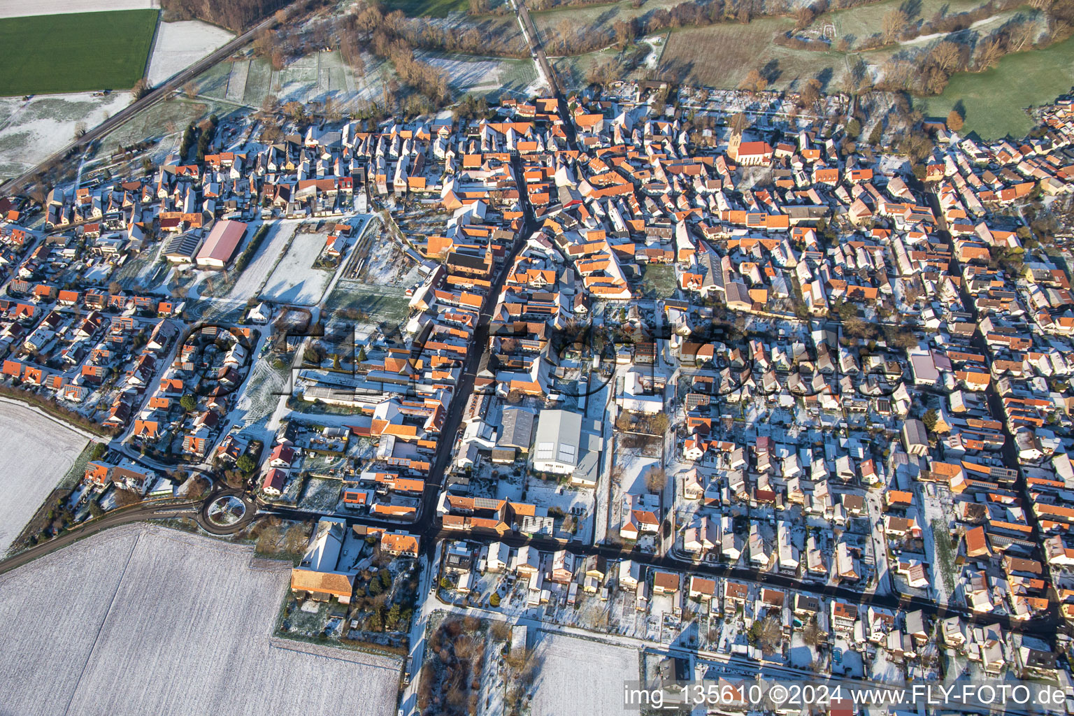 Aerial photograpy of Main street in winter with snow in Steinweiler in the state Rhineland-Palatinate, Germany