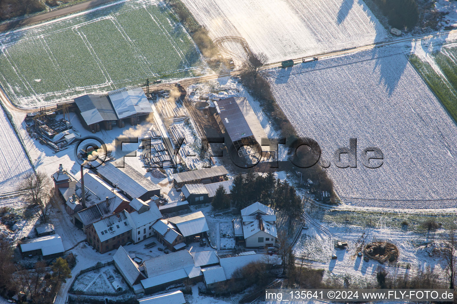 Aerial view of Holzwerk ORTH in winter with snow in the district Schaidt in Wörth am Rhein in the state Rhineland-Palatinate, Germany