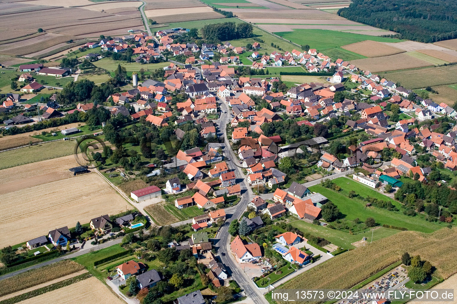 Aerial view of Village - view on the edge of agricultural fields and farmland in Salmbach in Grand Est, France