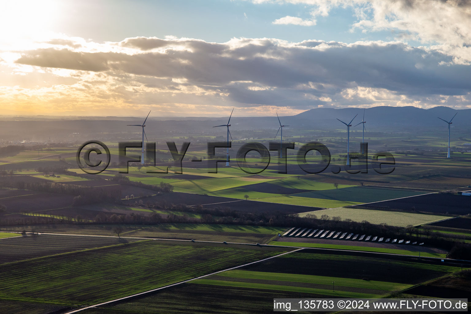 PV solar field in front of the Freckenfeld wind farm in Winden in the state Rhineland-Palatinate, Germany