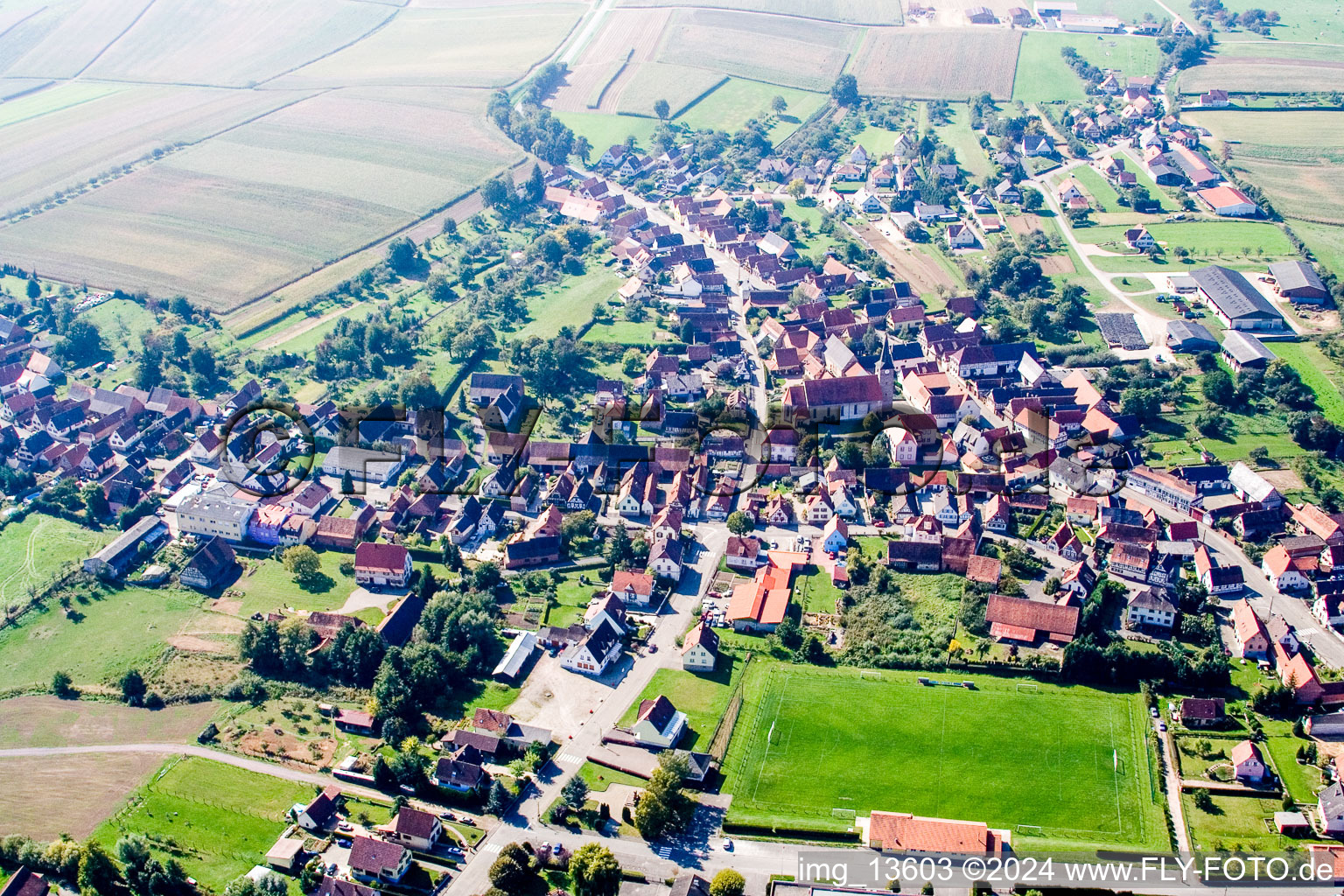 Oblique view of Village - view on the edge of agricultural fields and farmland in Riedseltz in Grand Est, France