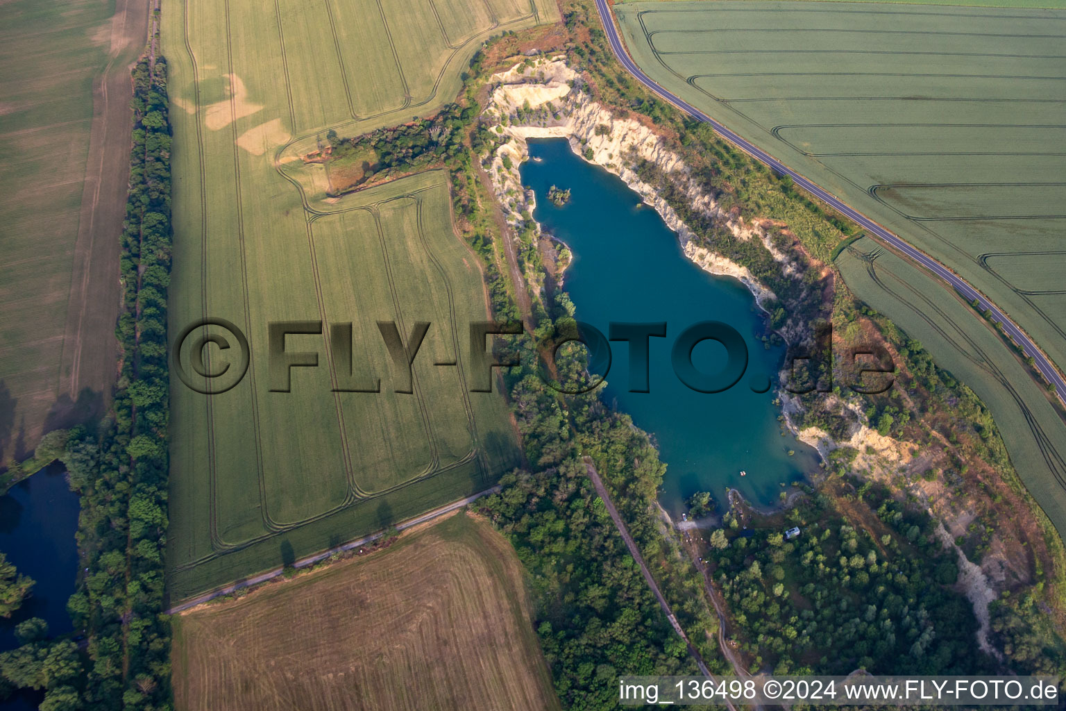 Aerial view of Quarry lake at Bahnhofstr in the district Ermsleben in Falkenstein in the state Saxony-Anhalt, Germany