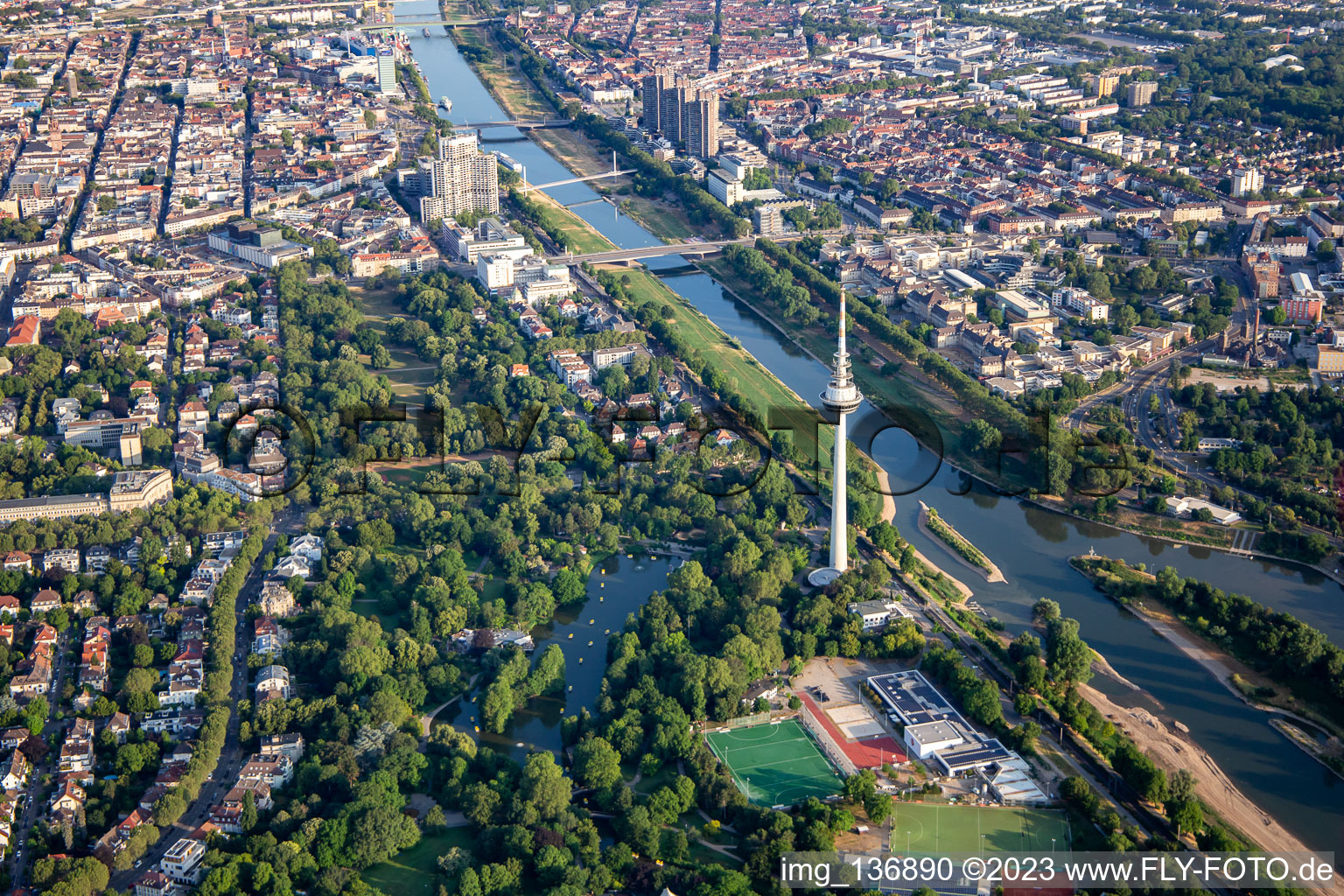 Telecommunications tower and Kutzerweiher in Luisenpark on the banks of the Neckar in the district Oststadt in Mannheim in the state Baden-Wuerttemberg, Germany