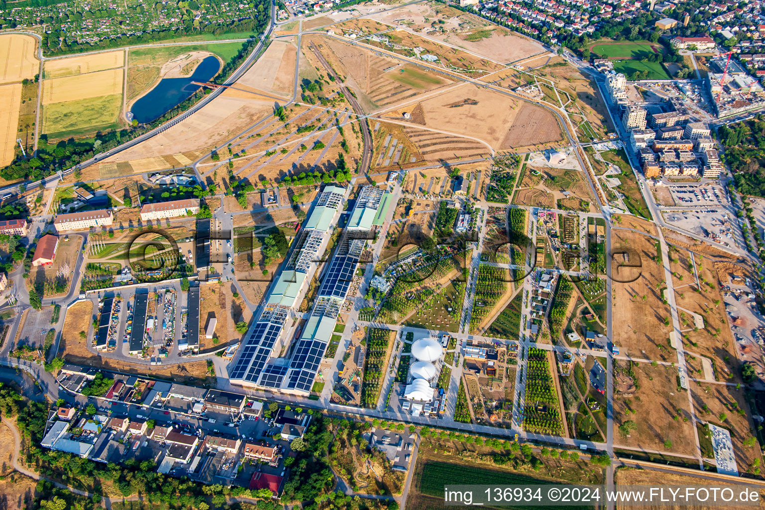 General view from the north of the Spinelli Park of the Federal Garden Show Mannheim BUGA 2023 with cable car to Luisenpark in the district Feudenheim in Mannheim in the state Baden-Wuerttemberg, Germany