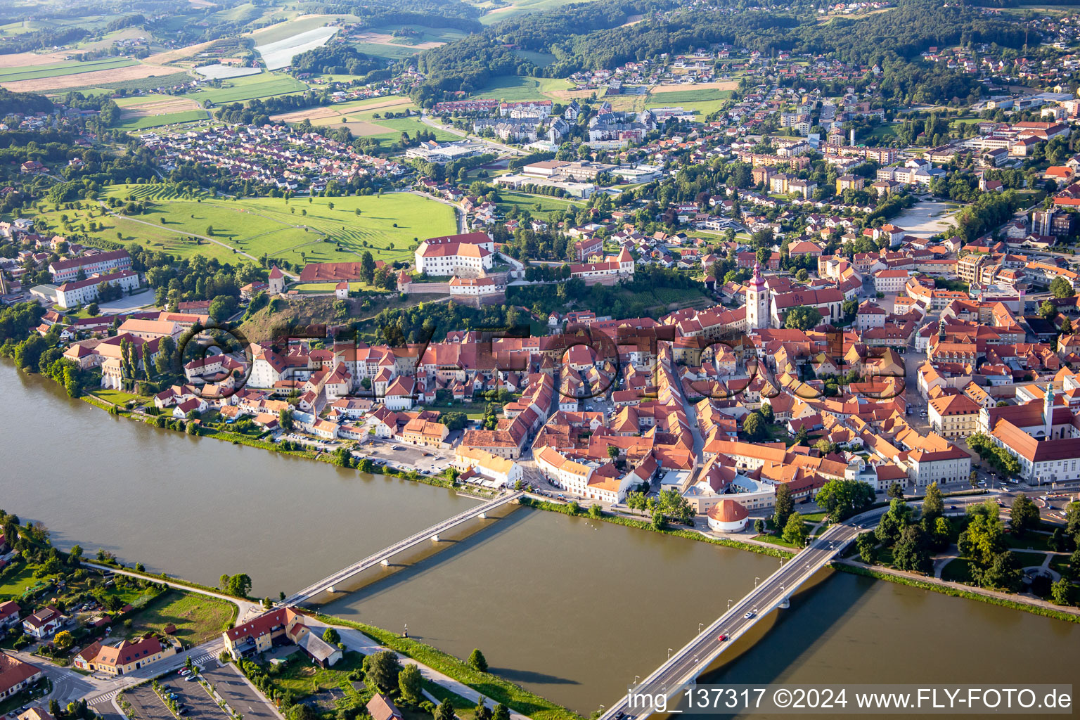 Aerial view of Old town from the south behind the bridges over the Drava/Dravo in Ptuj in the state Slovenia, Slovenia