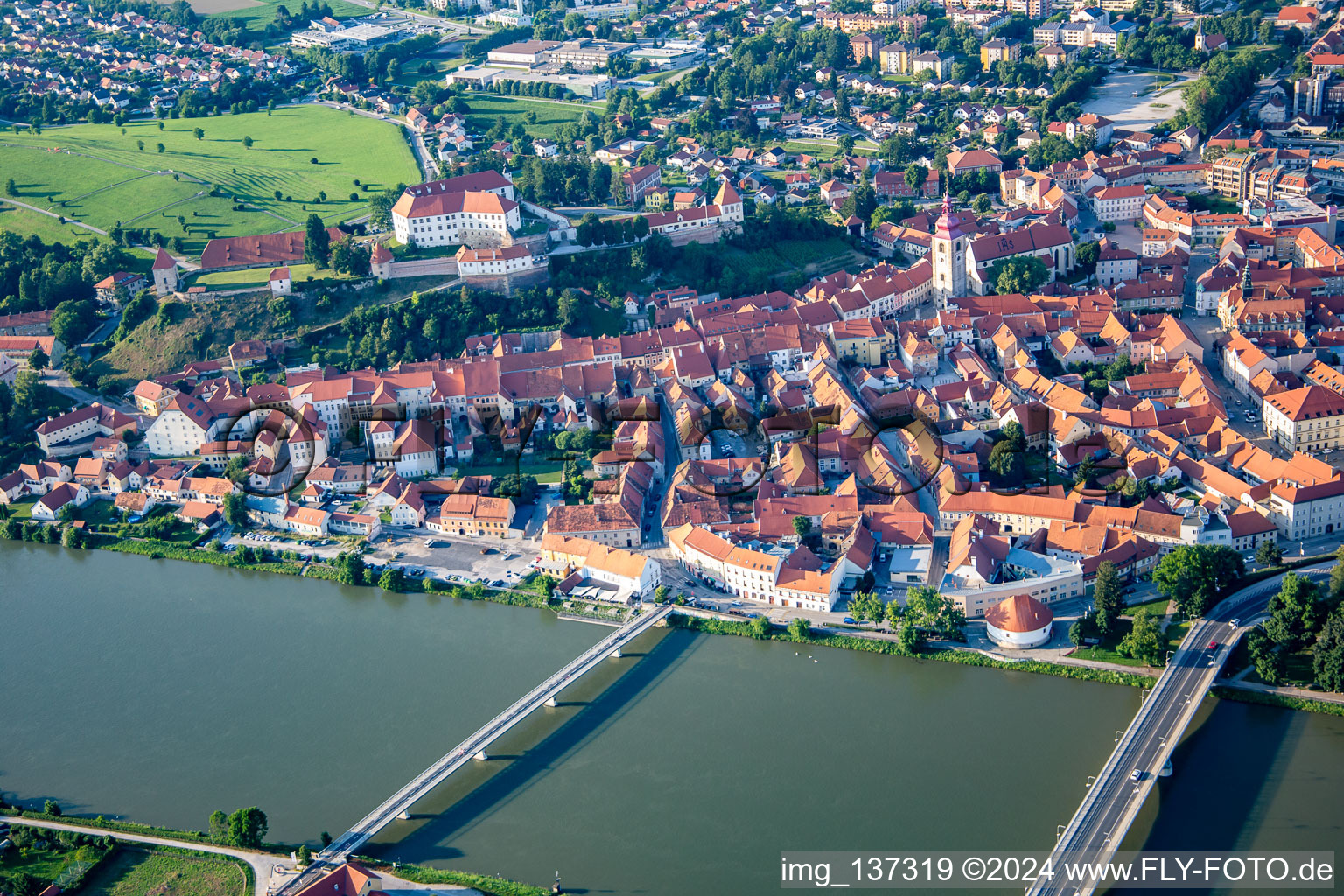 Aerial photograpy of Old town from the south behind the bridges over the Drava/Dravo in Ptuj in the state Slovenia, Slovenia