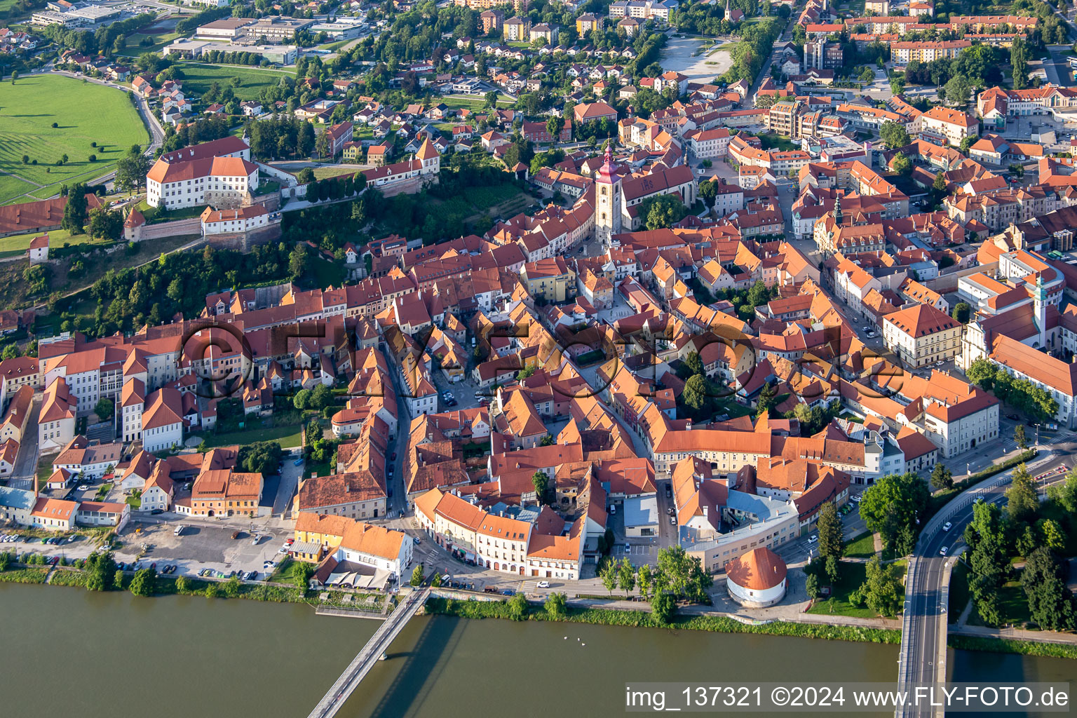 Oblique view of Old town from the south behind the bridges over the Drava/Dravo in Ptuj in the state Slovenia, Slovenia