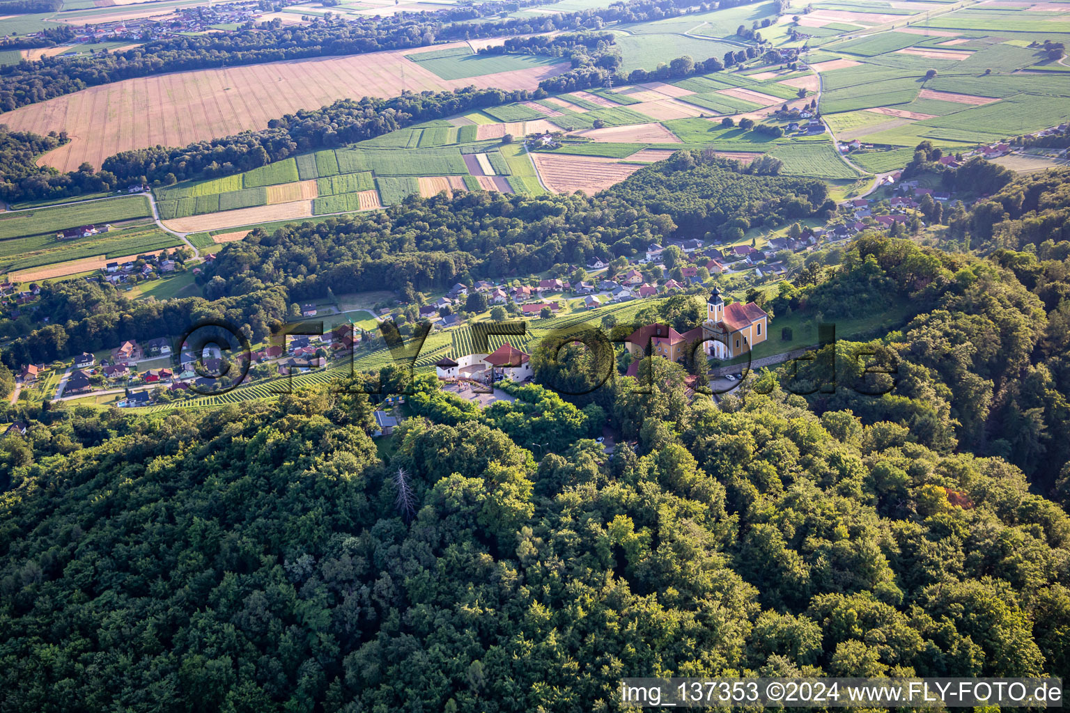 Aerial view of Church of Župnijska cerkev sv. Marije Vnebovzete and Café Huda Liza on the Vurberg in Duplek in the state Slovenia, Slovenia