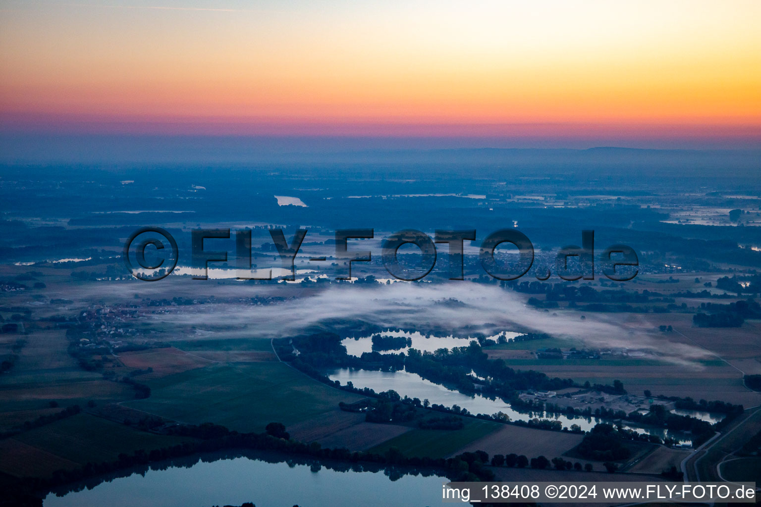 Upper Altrhein in the morning mist before sunrise in Neupotz in the state Rhineland-Palatinate, Germany