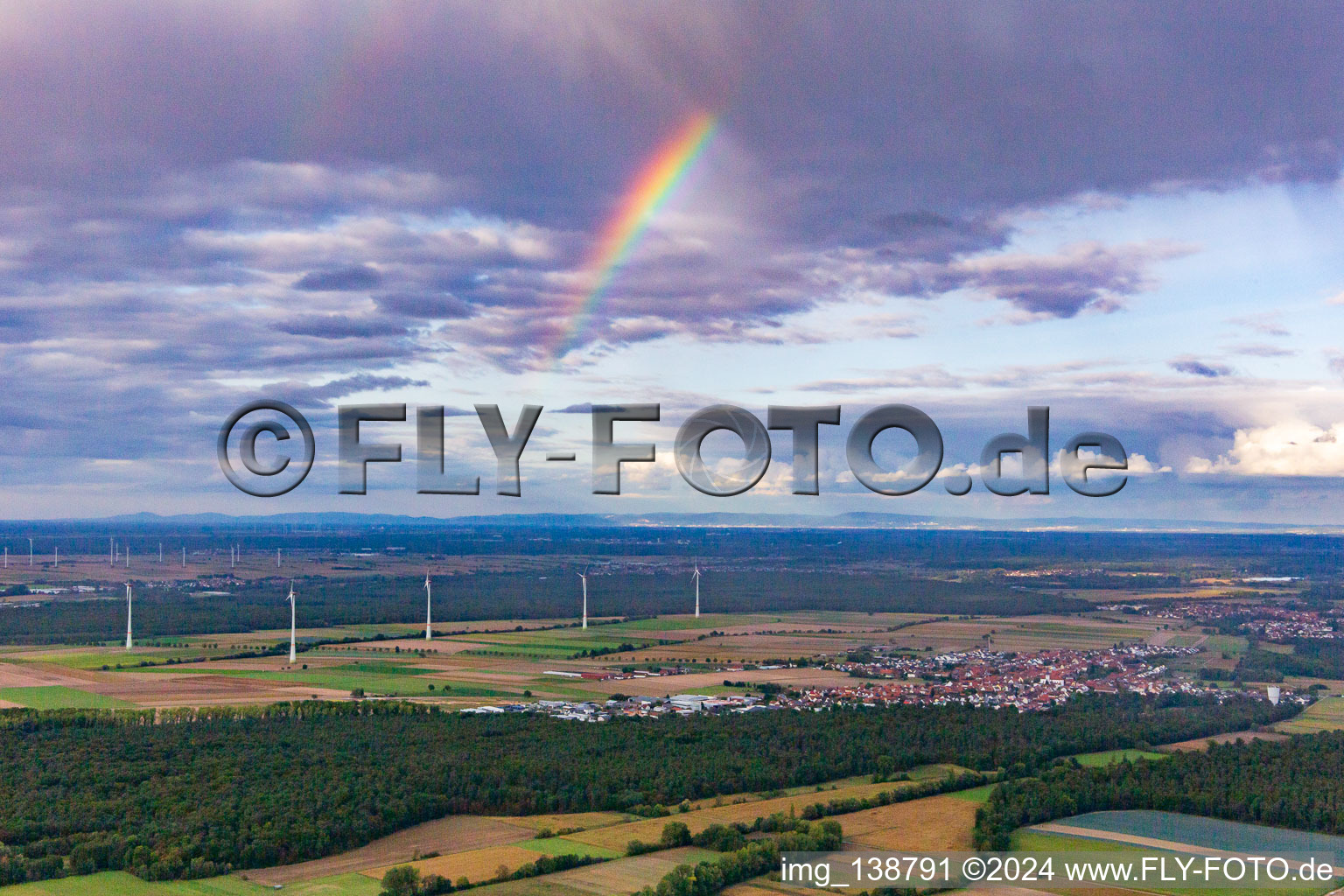 Rainbow over the wind turbines at Hatzenbühl in Hatzenbühl in the state Rhineland-Palatinate, Germany