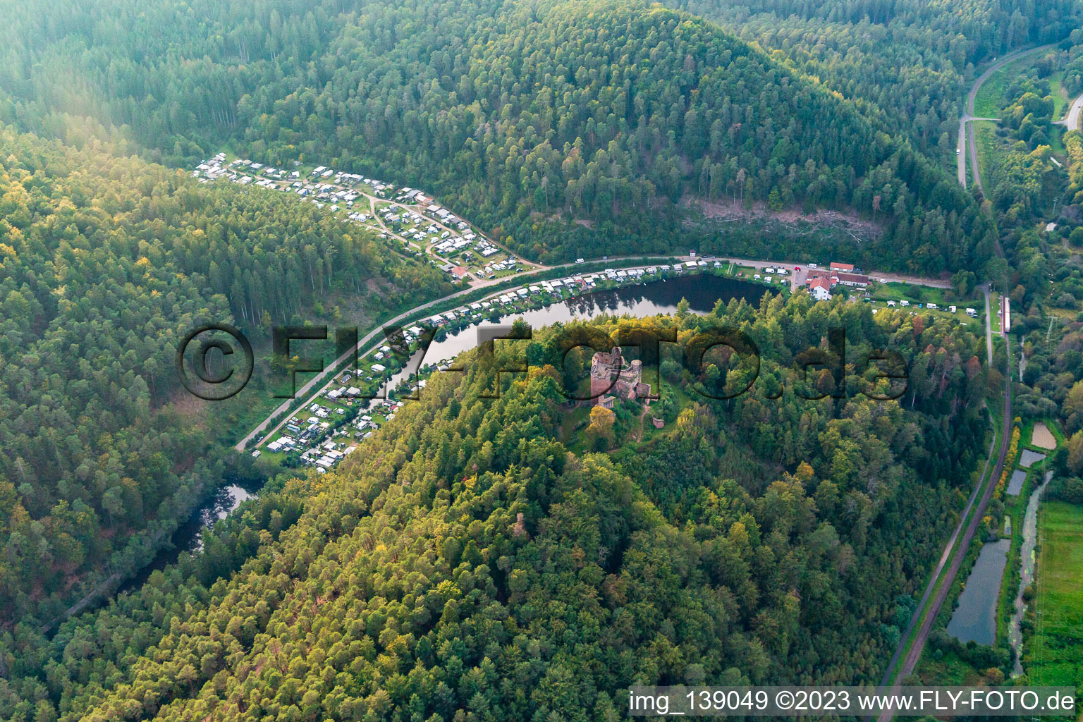 Aerial view of Neudahn Castle ruins above the Neudahner Weiher campsite in Dahn in the state Rhineland-Palatinate, Germany