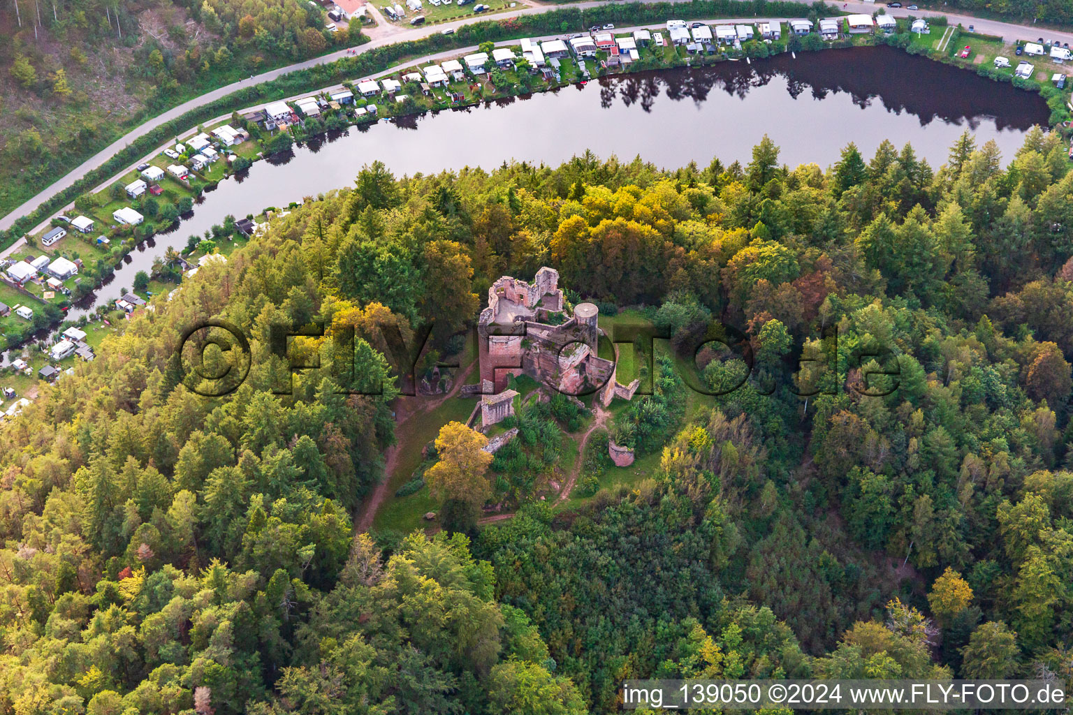 Aerial photograpy of Neudahn Castle ruins above the Neudahner Weiher campsite in Dahn in the state Rhineland-Palatinate, Germany