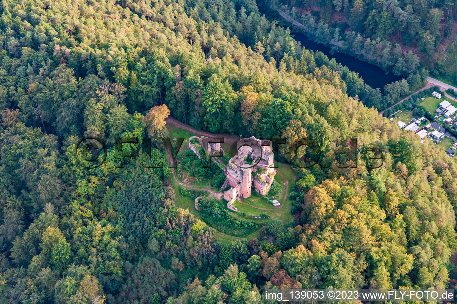 Neudahn castle ruins above the Neudahner Weiher campsite in Dahn in the state Rhineland-Palatinate, Germany from above