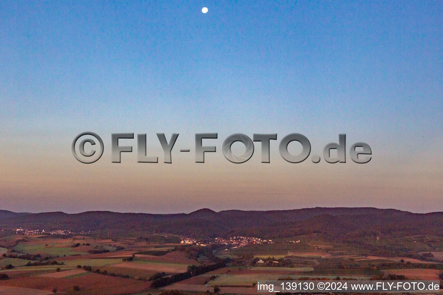 Moon over Oberotterbach in Oberotterbach in the state Rhineland-Palatinate, Germany