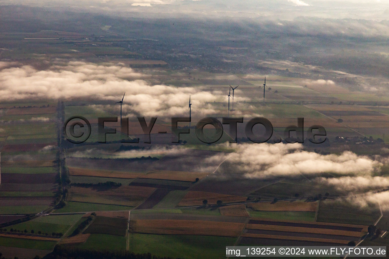 Minfeld wind farm in the morning mist in Kandel in the state Rhineland-Palatinate, Germany