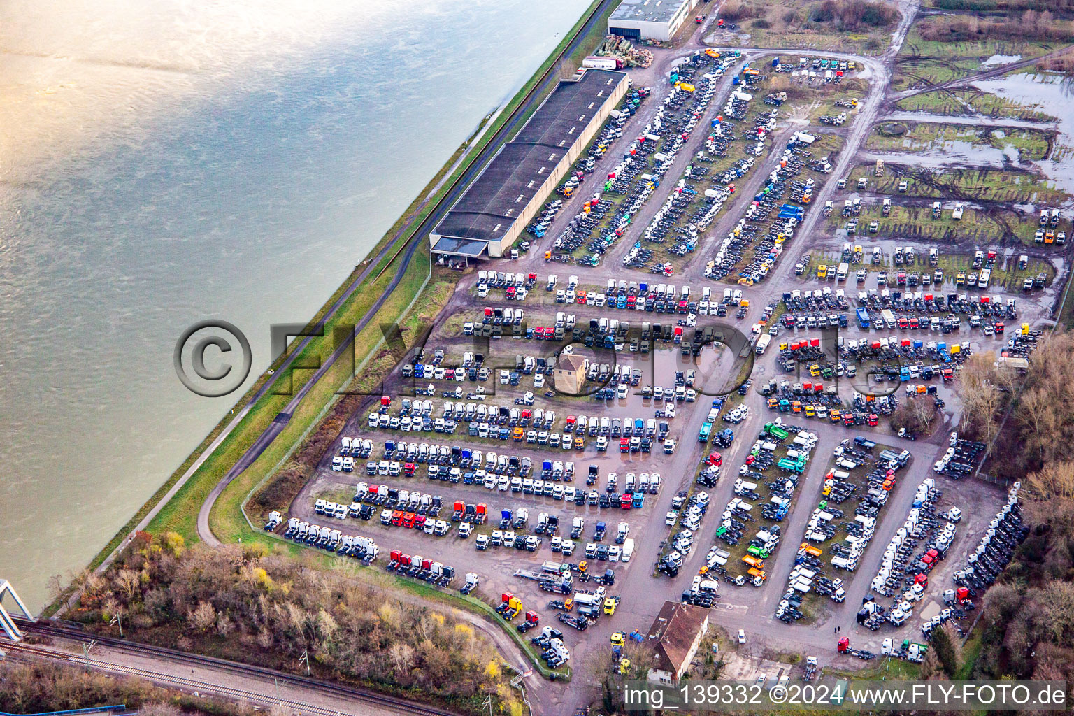 Truck storage of Zeltmann Kfz-Transfer GmbH on the banks of the Rhine Maximiliansau in the district Maximiliansau in Wörth am Rhein in the state Rhineland-Palatinate, Germany