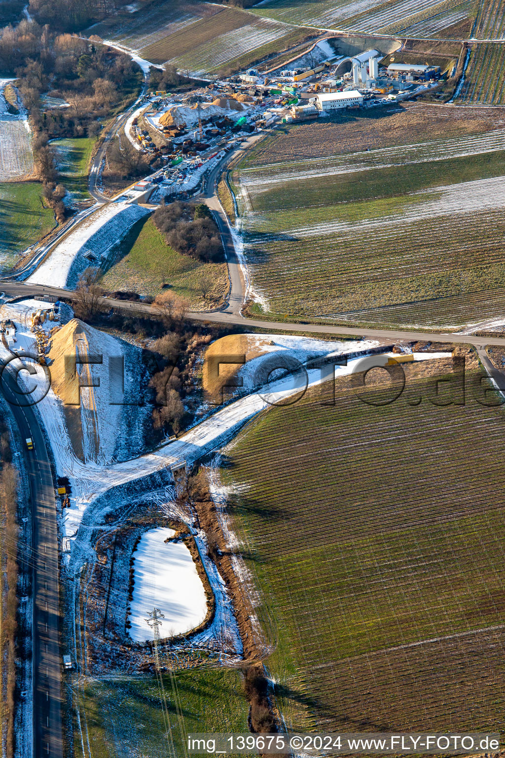 Aerial view of Tunnel construction site in winter with snow in Dörrenbach in the state Rhineland-Palatinate, Germany