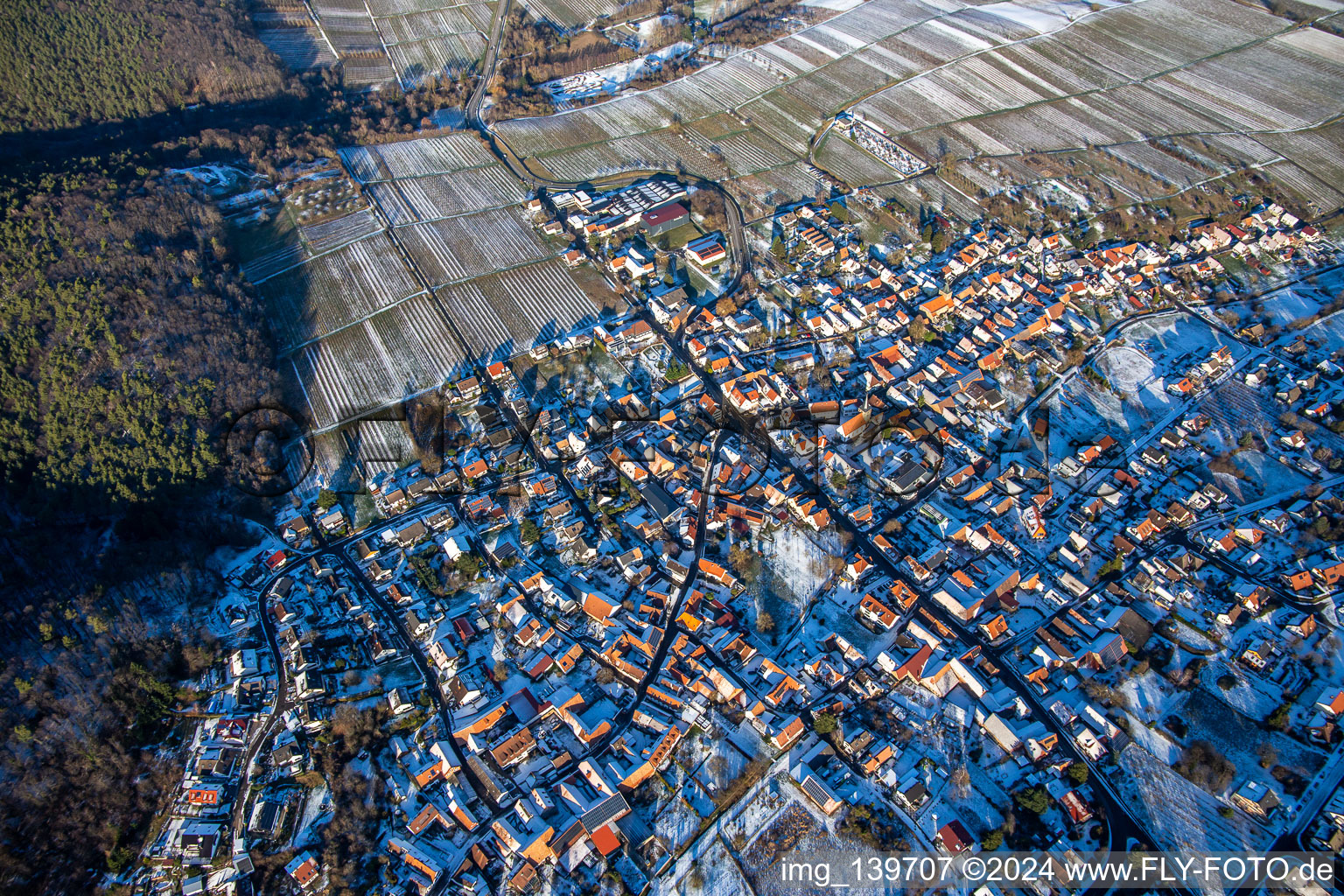 Aerial view of In winter with snow from the southwest in Oberotterbach in the state Rhineland-Palatinate, Germany