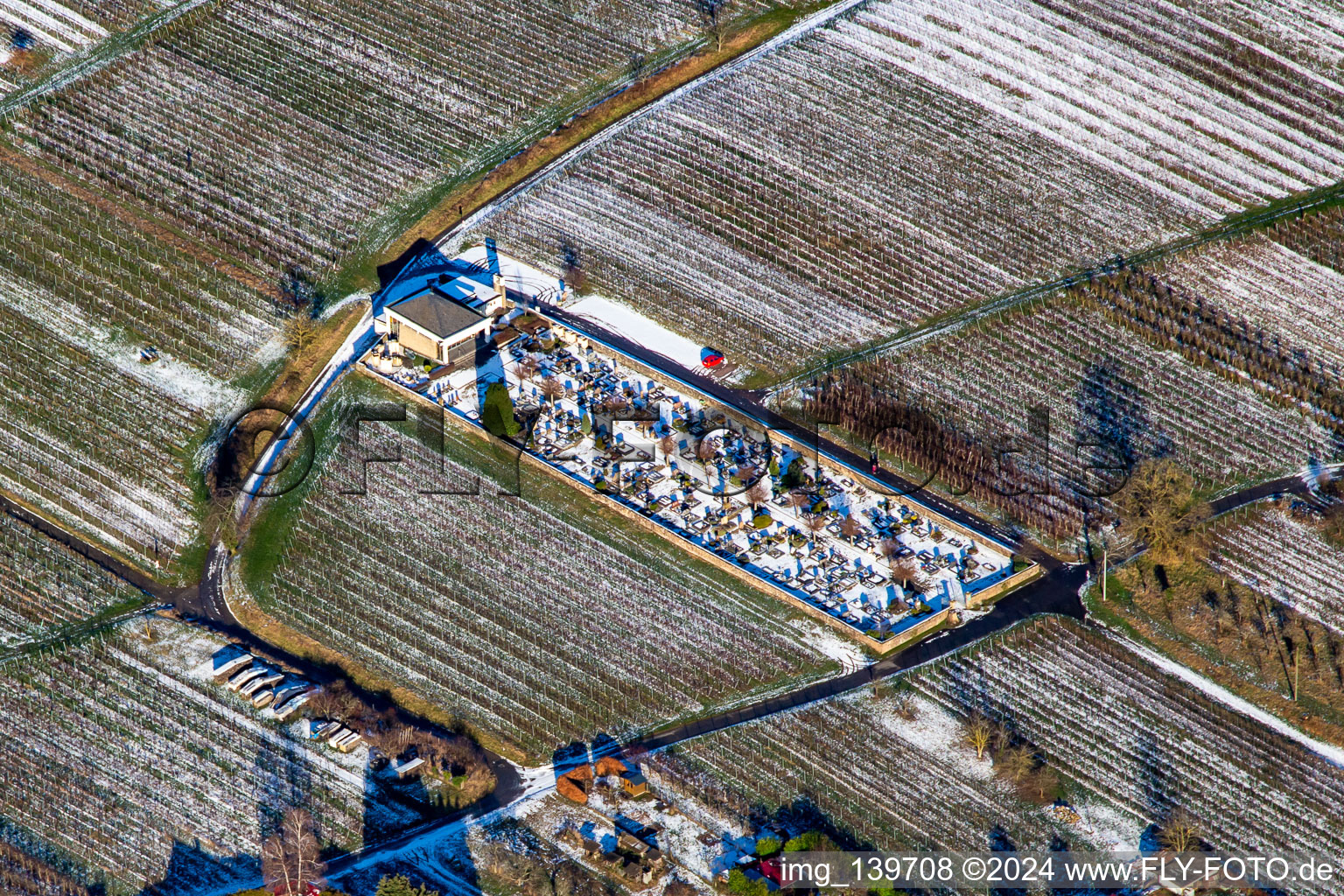 Cemetery in winter with snow in Oberotterbach in the state Rhineland-Palatinate, Germany