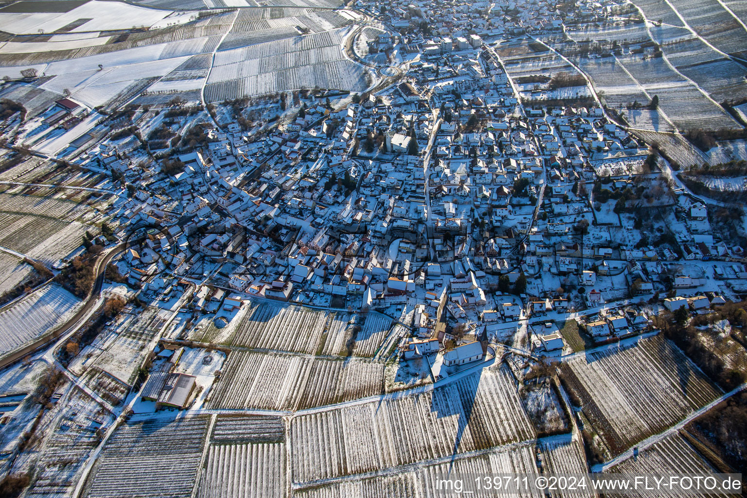 Aerial view of In winter with snow from the northwest in the district Rechtenbach in Schweigen-Rechtenbach in the state Rhineland-Palatinate, Germany